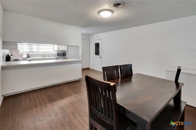 2307 E Airline Rd, Victoria, TX 77901 - dining space with dark wood-style flooring