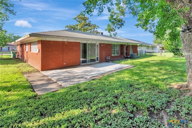 2307 E Airline Rd, Victoria, TX 77901 - rear view of house featuring brick siding and a patio area