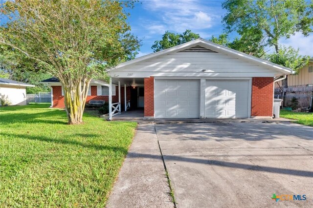 2307 E Airline Rd, Victoria, TX 77901 - ranch-style home featuring brick siding and a detached garage
