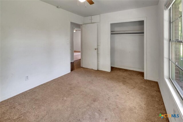 2307 E Airline Rd, Victoria, TX 77901 - unfurnished bedroom featuring carpet, a closet, and ceiling fan