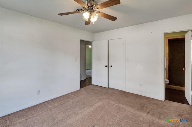 2307 E Airline Rd, Victoria, TX 77901 - unfurnished bedroom featuring carpet flooring, ensuite bath, ceiling fan, and a closet