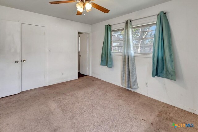 2307 E Airline Rd, Victoria, TX 77901 - unfurnished bedroom with carpet floors and a ceiling fan