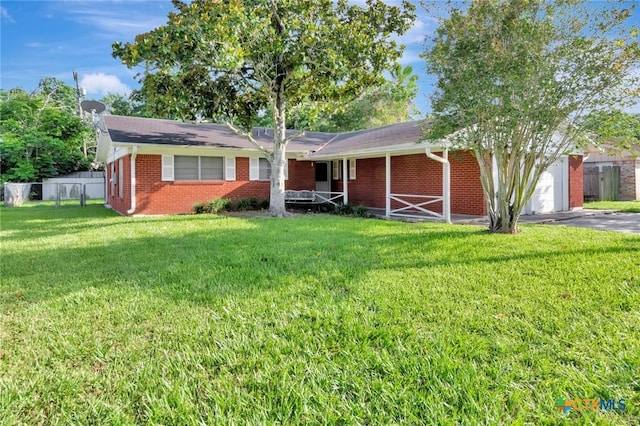 2307 E Airline Rd, Victoria, TX 77901 - ranch-style house featuring brick siding, asphalt driveway, and an attached garage