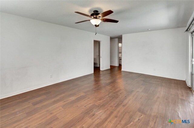 2307 E Airline Rd, Victoria, TX 77901 - spare room featuring a ceiling fan and dark wood-type flooring