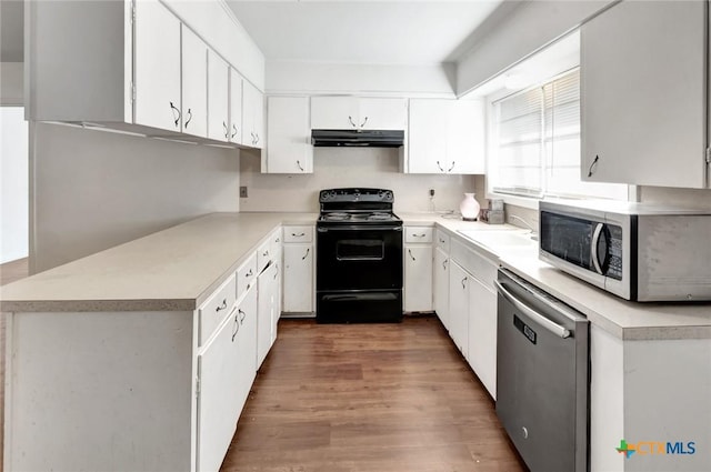 2307 E Airline Rd, Victoria, TX 77901 - kitchen featuring stainless steel appliances, under cabinet range hood, light countertops, and white cabinets