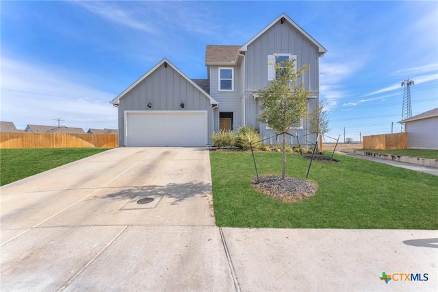 view of front of house with a front yard and a garage