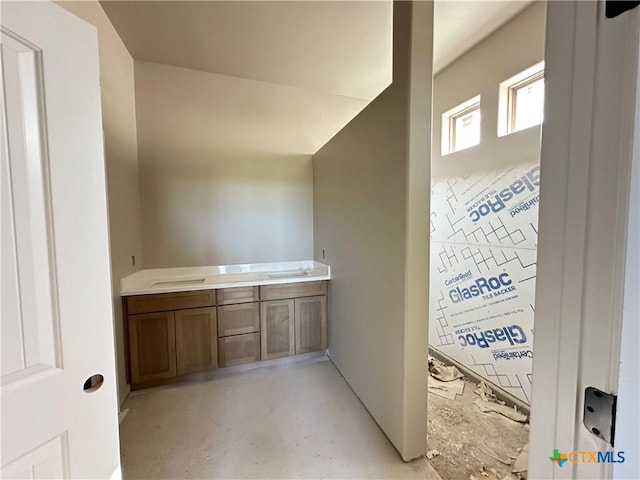 bathroom with concrete flooring