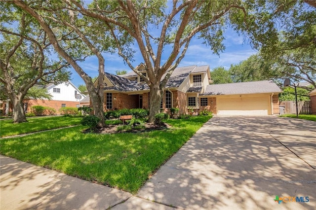 504 Masters Dr, Victoria, TX 77904 - view of front of house featuring brick siding, a garage, and concrete driveway