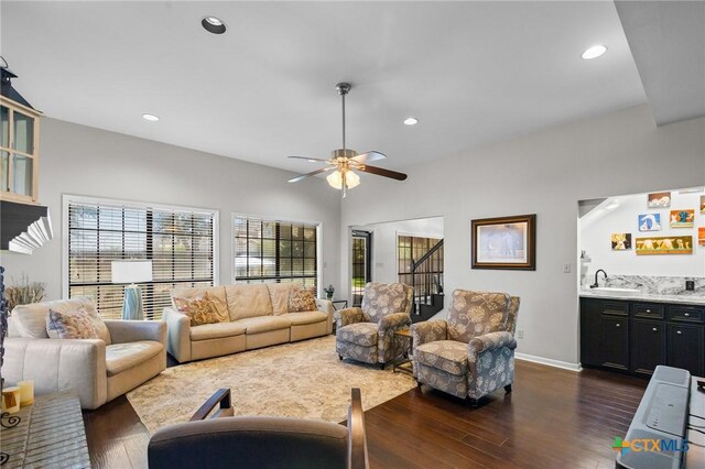 504 Masters Dr, Victoria, TX 77904 - living room featuring dark wood-type flooring, recessed lighting, stairs, wet bar, and ceiling fan