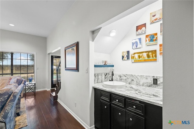 504 Masters Dr, Victoria, TX 77904 - bathroom with hardwood / wood-style flooring, recessed lighting, vanity, and lofted ceiling