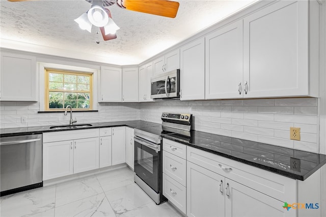 kitchen with white cabinets, sink, and stainless steel appliances