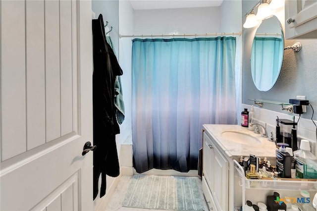 11 Enchanted Ln, Port Lavaca, TX 77979 - bathroom with vanity and shower / tub combo with curtain