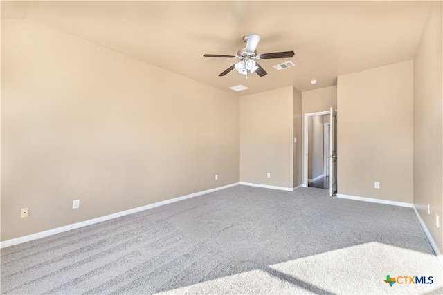 carpeted empty room featuring ceiling fan