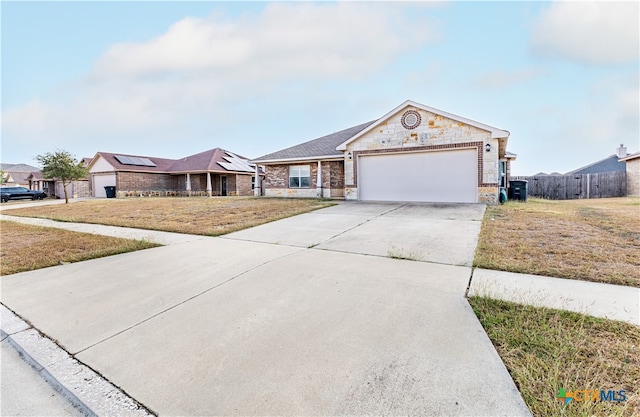 single story home with a front lawn and a garage