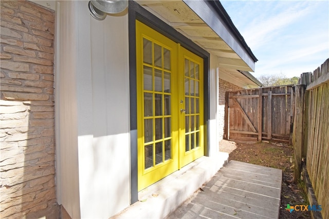 view of property exterior featuring french doors