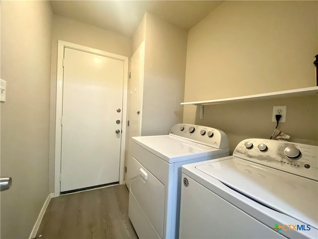 washroom featuring separate washer and dryer and dark hardwood / wood-style flooring