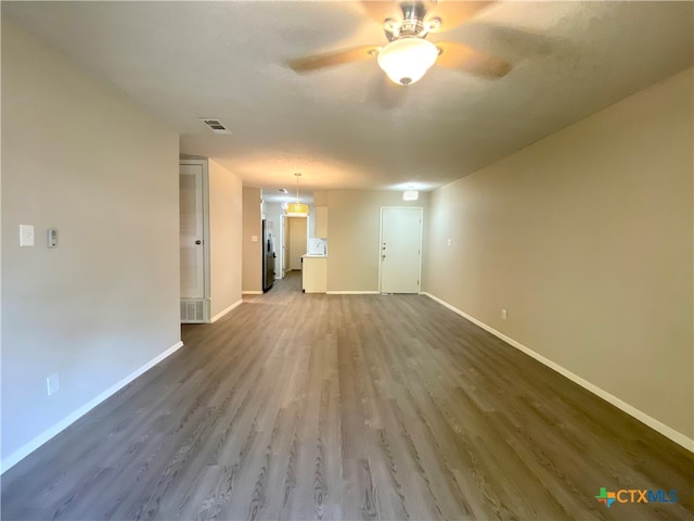 spare room with hardwood / wood-style flooring and ceiling fan