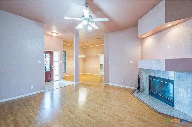 4803 Chad Dr, Killeen, TX 76542 - unfurnished living room with baseboards, ceiling fan, a fireplace, and wood finished floors