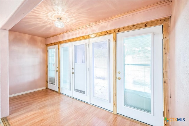 4803 Chad Dr, Killeen, TX 76542 - doorway to outside featuring baseboards and light wood-type flooring