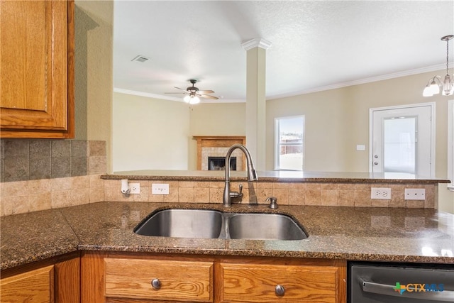 127 Ariana Ct, Killeen, TX 76542 - kitchen featuring dishwasher, brown cabinetry, backsplash, ornamental molding, and a ceiling fan