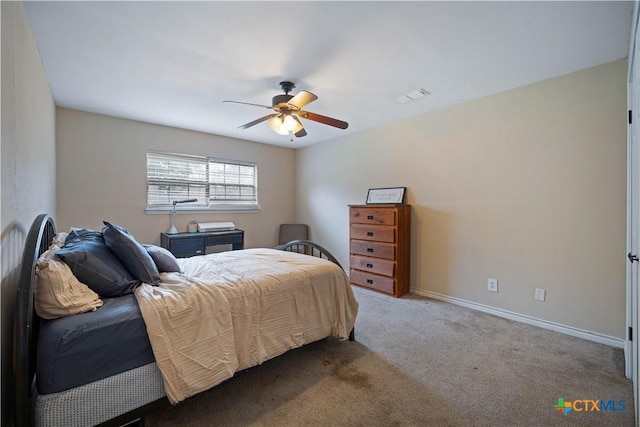 bedroom featuring a ceiling fan, carpet, visible vents, and baseboards