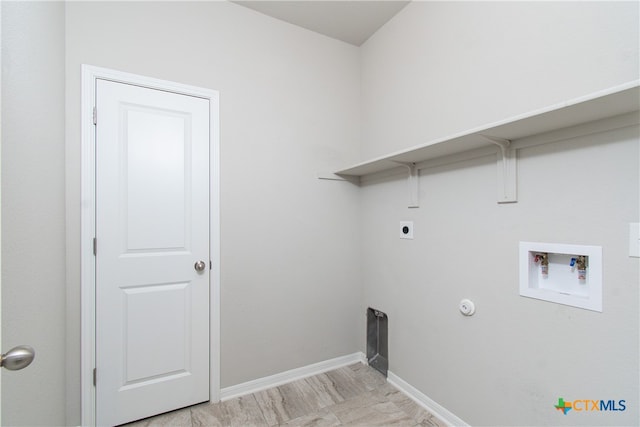 clothes washing area with electric dryer hookup, hookup for a gas dryer, and washer hookup