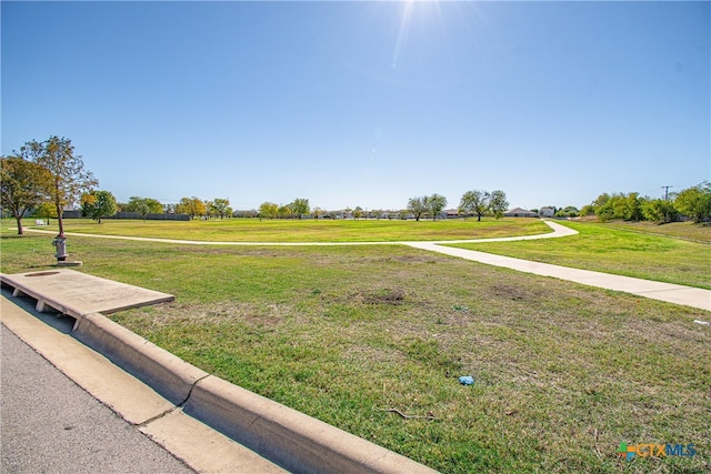 view of home's community featuring a lawn