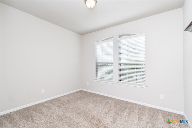 unfurnished room with carpet floors