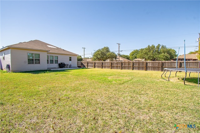 view of yard with a trampoline