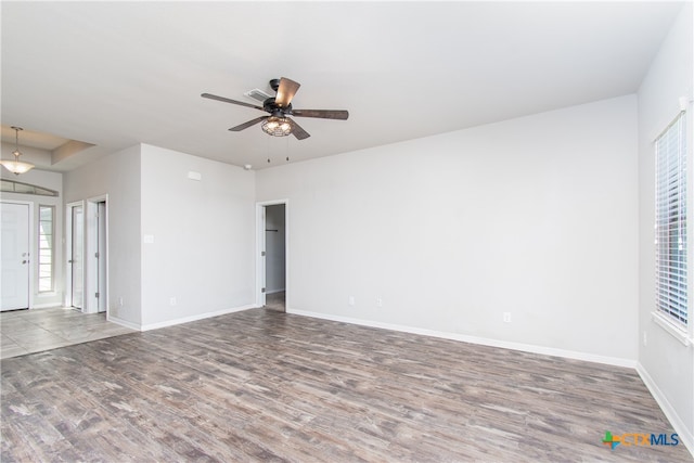 unfurnished room featuring ceiling fan and hardwood / wood-style flooring