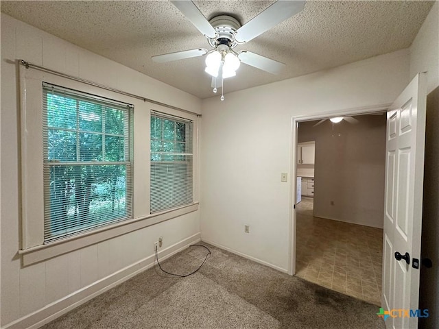 1015 N 3rd St, Temple, TX 76501 - empty room with ceiling fan, carpet floors, and a textured ceiling
