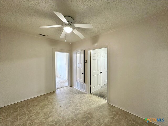 1015 N 3rd St, Temple, TX 76501 - unfurnished room featuring a textured ceiling and ceiling fan