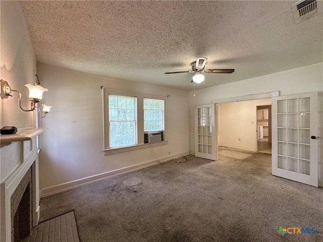 1015 N 3rd St, Temple, TX 76501 - unfurnished living room featuring french doors, ceiling fan, a textured ceiling, carpet, and cooling unit