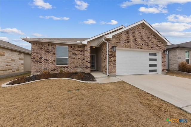 ranch-style home with a garage and a front lawn