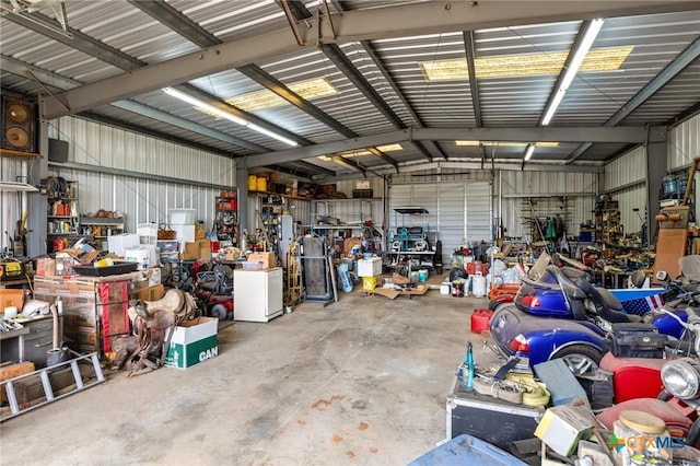 garage featuring a workshop area and metal wall