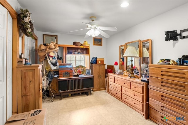 bedroom featuring ceiling fan, light floors, and recessed lighting