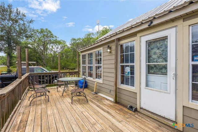wooden deck featuring outdoor dining space