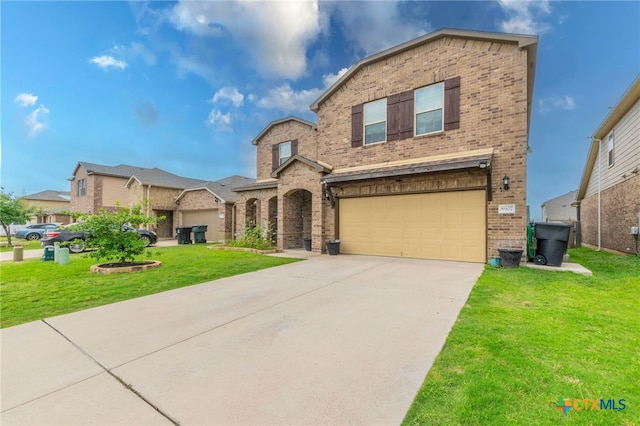 8907 Misty Pine Dr, Temple, TX 76502 - view of front of property with brick siding, a garage, concrete driveway, and a front lawn