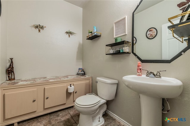 8907 Misty Pine Dr, Temple, TX 76502 - half bath with toilet and tile patterned floors