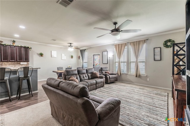 8907 Misty Pine Dr, Temple, TX 76502 - living area featuring a ceiling fan, light carpet, ornamental molding, and recessed lighting