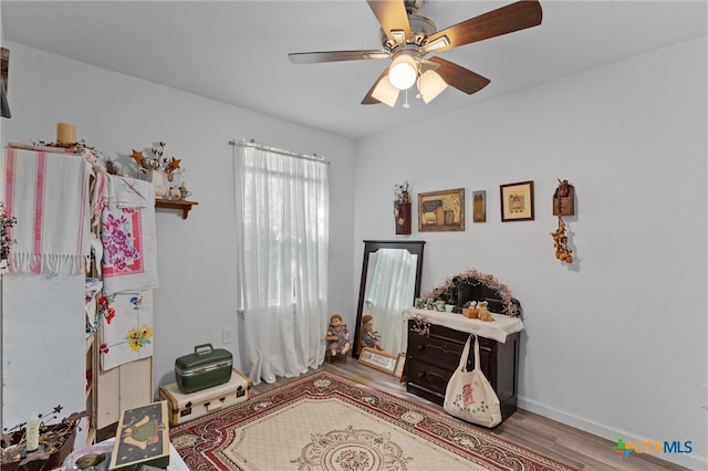 interior space with hardwood / wood-style flooring and ceiling fan