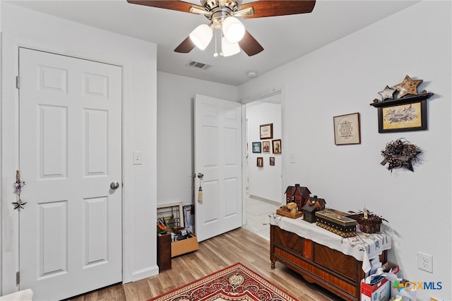 interior space with light hardwood / wood-style floors and ceiling fan