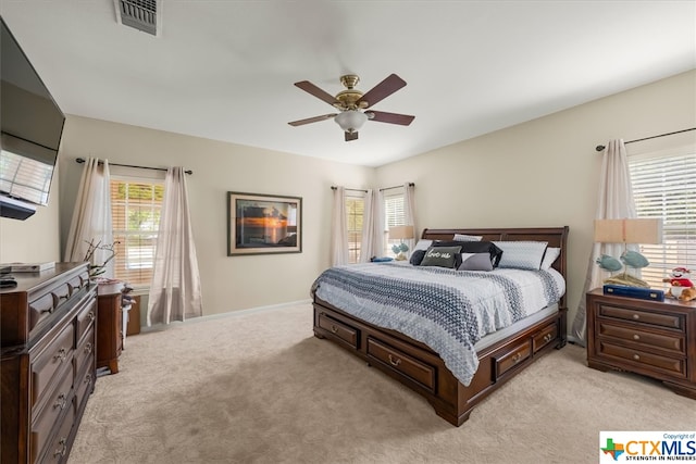 carpeted bedroom featuring ceiling fan