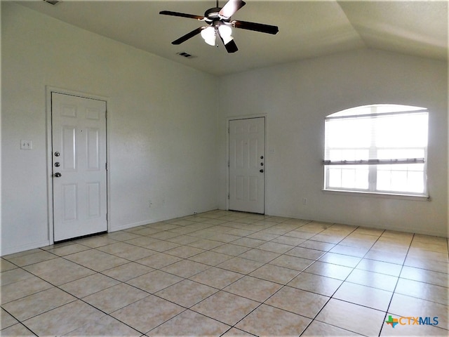 unfurnished room featuring light tile patterned flooring, ceiling fan, and lofted ceiling