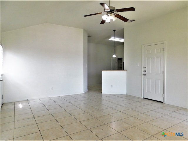 empty room featuring ceiling fan and light tile patterned flooring