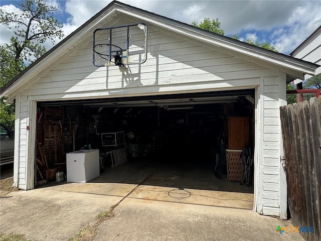 garage with fence