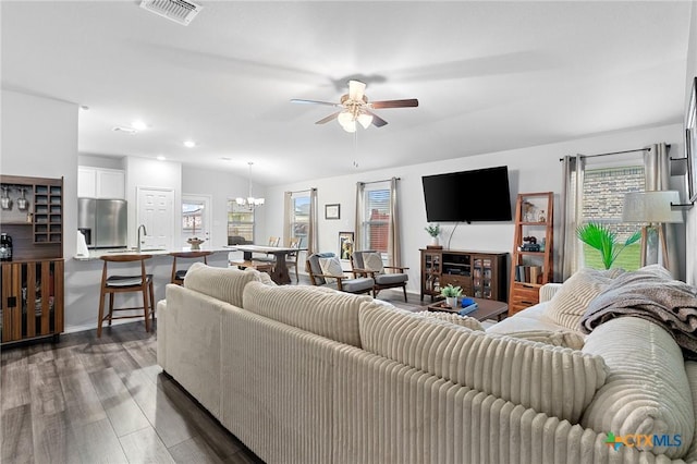 2512 Corradino St, Harker Heights, TX 76548 - living area featuring healthy amount of natural light, dark wood-type flooring, a ceiling fan, a chandelier, and recessed lighting