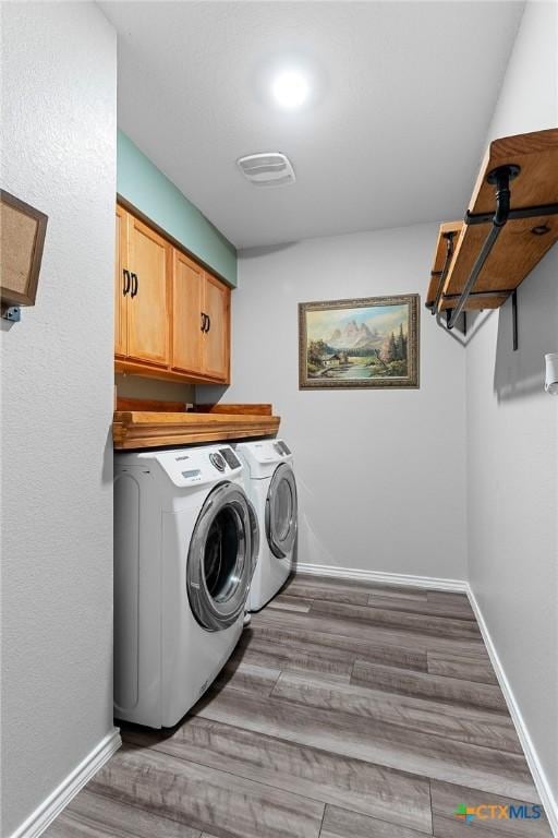 2512 Corradino St, Harker Heights, TX 76548 - clothes washing area with independent washer and dryer, cabinet space, wood finished floors, and baseboards