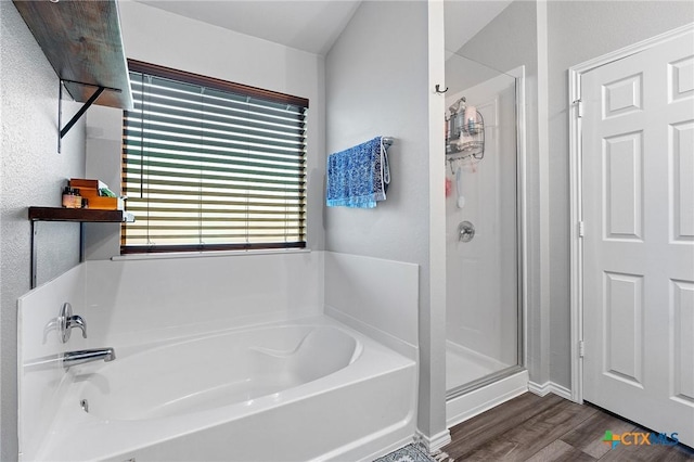 2512 Corradino St, Harker Heights, TX 76548 - full bathroom featuring wood finished floors, a shower stall, a bath, and baseboards