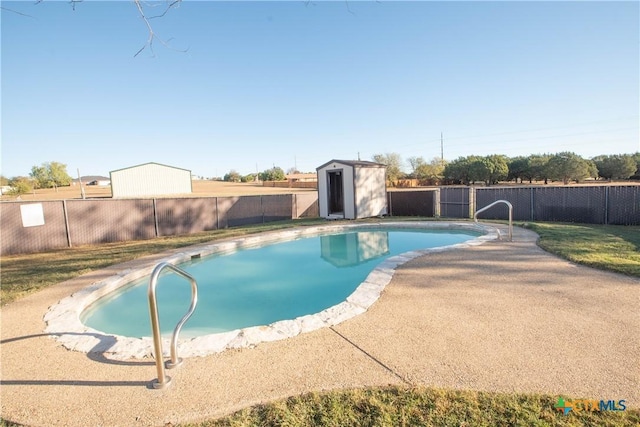 view of pool with a shed